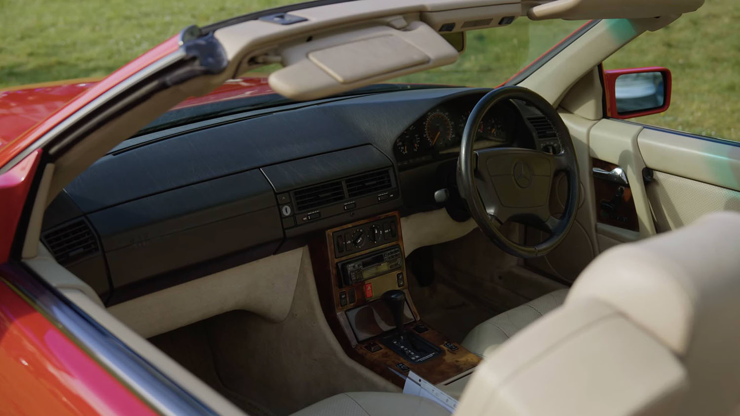 Mercedes-Benz SL R129 interior with cream leather seats, dashboard and centre console